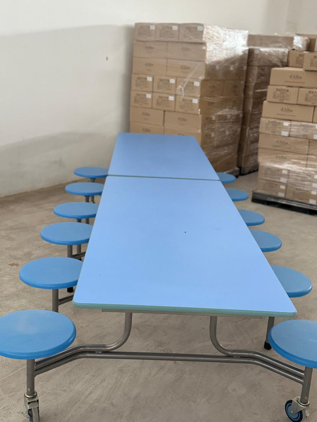 Blue 12-seater foldable mobile cafeteria table with integrated round stools and steel frame